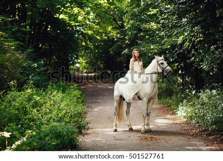 The bride  riding a horse