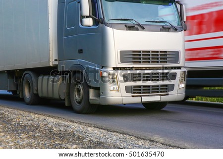 trucks transporting freight on the country highway
