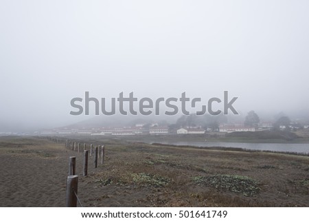 Fence Posts in Fog at Fort Cronkhite Royalty-Free Stock Photo #501641749