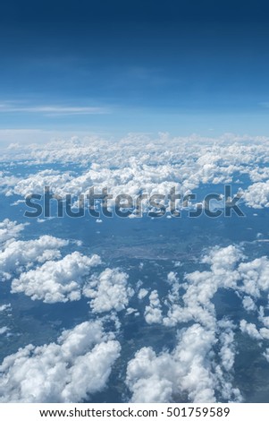 Skyline at air plane above clouds with city view under cloud,aerial view landscape. Royalty-Free Stock Photo #501759589