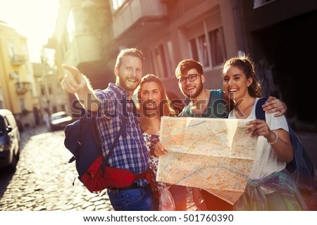 Happy tourists exploring travel destination city Royalty-Free Stock Photo #501760390