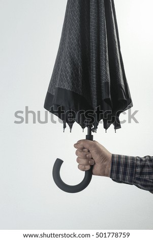 an umbrella in hand