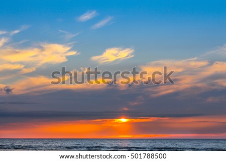 Amazing Colorful Beach Sunset over the Sea in Paradise Place using for Wallpaper