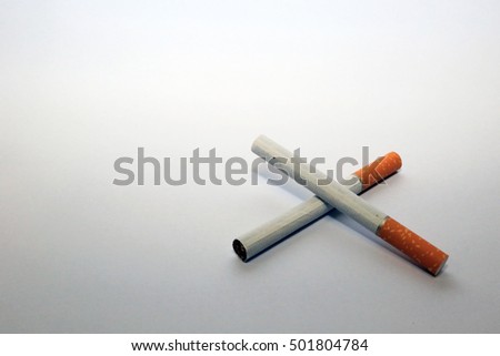 Cigarette broken isolated in white background.