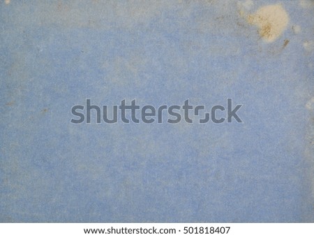 Old distressed vintage textured effect blank pale blue paper background