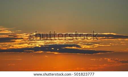 Dramatic sunset with colorful clouds in early autumn.
