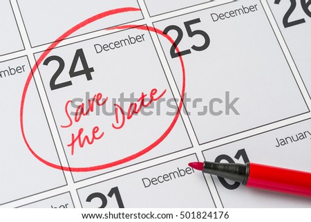Save the Date written on a calendar - December 24 Royalty-Free Stock Photo #501824176