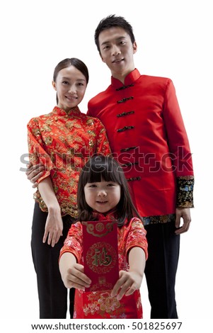 	Portrait of family,daughter holding up red envelope,parents standing behind,in Tang suits	