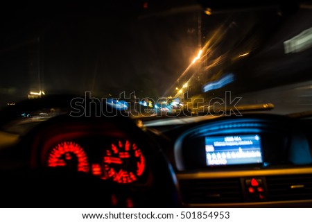drunk driver goes at night. view from inside. abstract Royalty-Free Stock Photo #501854953