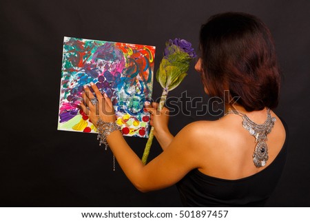 beautiful girl with a picture of the artist