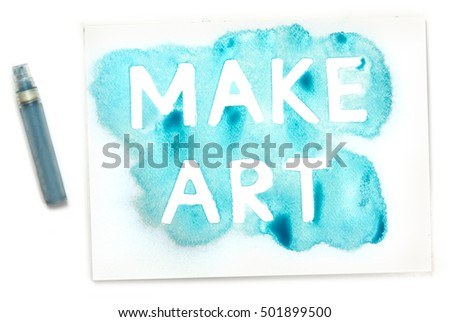 Make Art, written with the use of a stencil and blue paint, and the mister, on white background