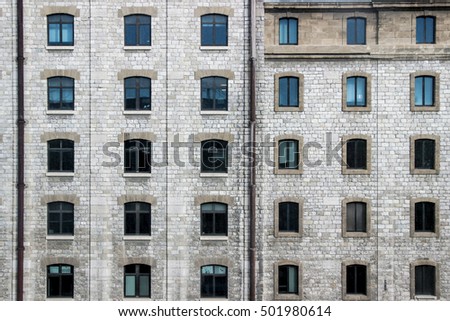 facade of windows on brick wall building in France