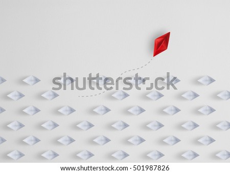  Business concept  as a group of paper ship in one direction and with one individual pointing in the different way as a business icon for innovative solution,minimal Royalty-Free Stock Photo #501987826