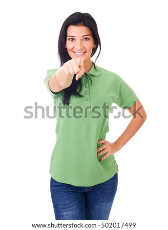 Young happy woman pointing at you, on a white background