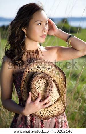 A shot of a beautiful asian girl outdoor
