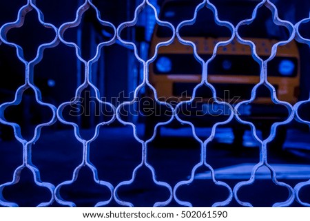 blue ornament grid on dark background with big car, red netting against dark back, netting grid as texture, high quality resolution