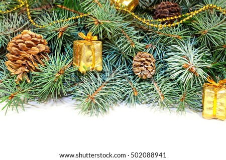 Christmas tree branches with cones, gifts