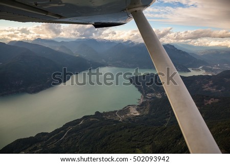 Flying around the mountains of British Columbia during a cloudy sunset. Picture taken near Squamish, Canada.