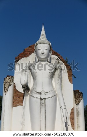 Standing Buddha Image at acient temple in Chan Royal Palace, Phitsanulok, Thailand