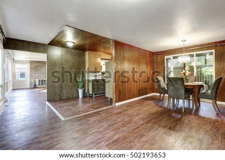 House interior. Open floor plan with hardwood floors in dining room, kitchen and living room. Northwest, USA