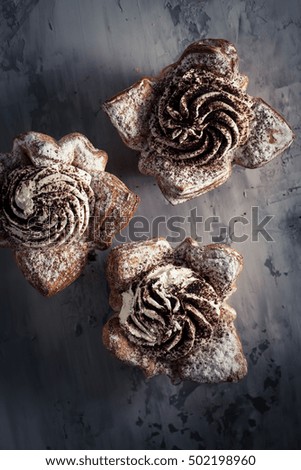 cakes cupcakes on gray concrete background,