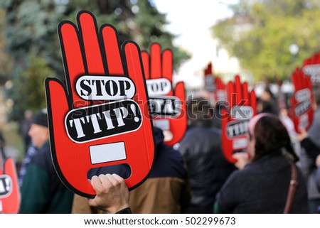Activists are holding red hand signs "Stop TTIP" during a demonstration against Free Trade Agreements TTIP, CETA and TISA between EU and U.S. in Sofia, Bulgaria. 