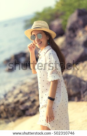 Portrait smiling summer vacation woman in hat and sunglasses