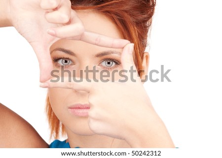 bright picture of lovely woman creating a frame with fingers