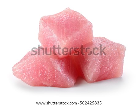 Raw pork fillet. Small cube pieces of meat isolated on white.