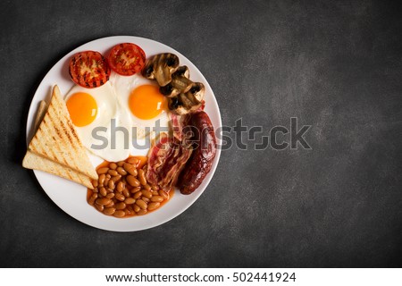 English breakfast on a black chalkboard, copy space for text Royalty-Free Stock Photo #502441924