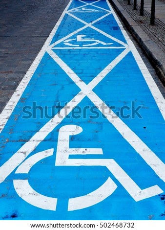 Three parking spaces for disabled people - painted on the street