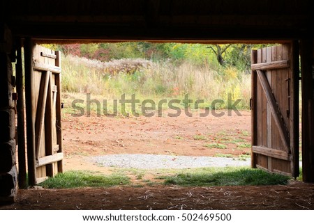 Open wooden gate old village barn Royalty-Free Stock Photo #502469500