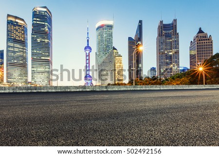 Asphalt roads and the beautiful urban scenery at night in Shanghai,China