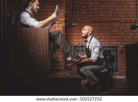 handsome artisan reading while working