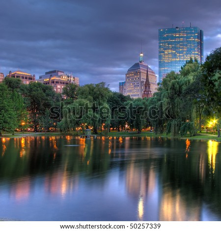 A HDR view of the Hancock towers in Boston viewed across the pond at the Public Gardens