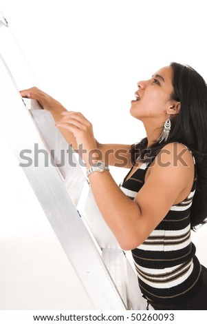 Young adult African-Indian businesswoman in casual office outfit Metaphorically climbing the ladder of success. Shot on a white backgroun, Not Isolated