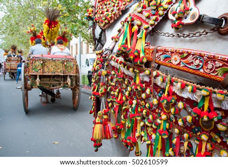 Close up view of a colorful harness of a typical sicilian cart during a folk festival