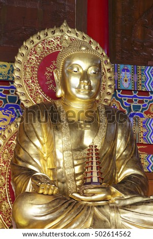 Golden Buddha statue in the temple, China
