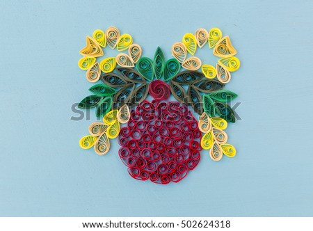 Christmas quiling decoration elements on blue board for background composition