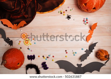 Halloween holiday background with pumpkin and bats. 