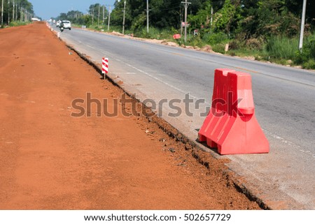 Barrier red plastic. Road construction.