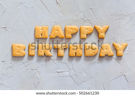 Letter cookies - HAPPY BIRTHDAY a concrete background