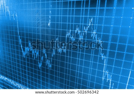 Stock diagram on the screen. Macro close-up. Data on live computer screen. Blue background with stock chart. Professional market analysis. Stock market graph and bar chart price display. 
 