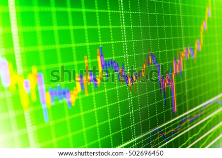Price chart bars. Data on live computer screen. Analysing stock market data on a monitor. Candle stick graph chart of stock market investment trading. Market report on blue background. 
