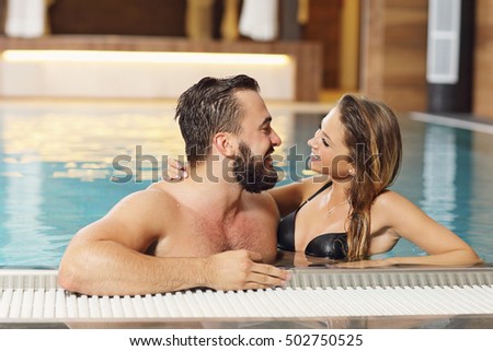 Picture of happy couple relaxing in pool spa