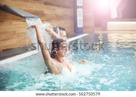 Picture of happy couple relaxing in pool spa
