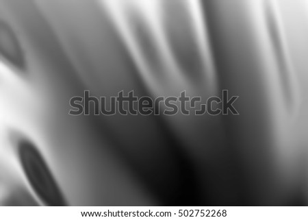 Gray silver fabric satin texture, shiny chrome surface, black glossy cloth, gradient textile, glitter silk material, abstract wool background blurred