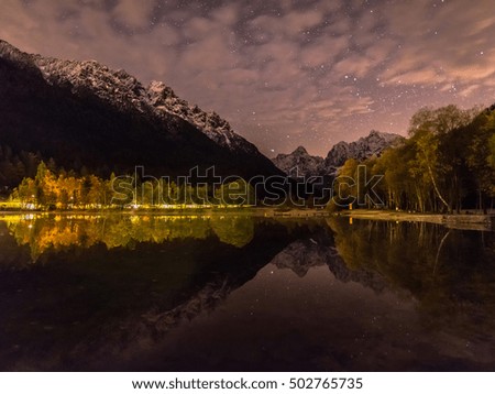 Jasna lake reflection at night. Starry reflection in the lake.