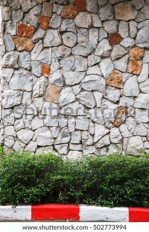 Texture old rock wall made of random stone background