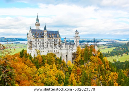 Neuschwanstein Castle, Germany. Image of the famous tourist attraction surrounded with autumn colors during fall.